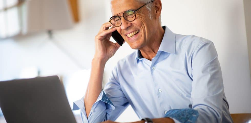 Man pays bill on phone with checking account.